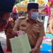 Bupati H. Sukiman Serahkan Dokumen Adminduk Dan Sertifikat TORA 427 Persil Desa Payung Sekaki, 106 Persil Desa Pagar Mayang
